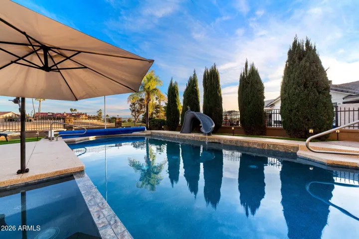 The relaxing hot tub flows into the heated pool.