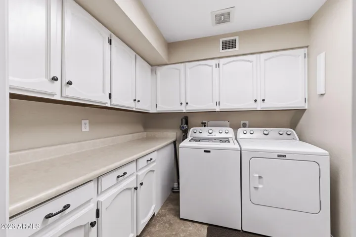 Loads of storage and counter space in the laundry room!