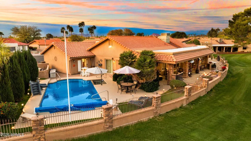 The back patio wraps around to the beautiful heated play pool.