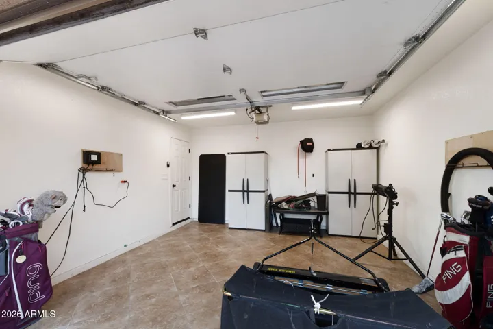 Double Golf Cart Garage with cabinets and lots of space for storage!