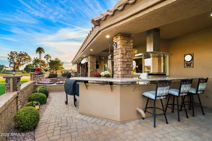 Back patio with a raised bar for seating, dining, coctails, entertaining!