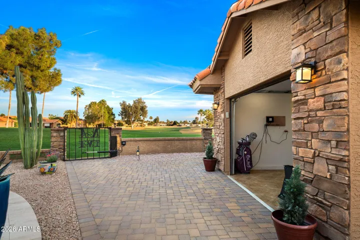 The Double Golf Cart Garage on the side of the home has its own pavered path and private gate to the golf course!