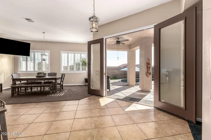 The area in front of the French doors could have a dining table.