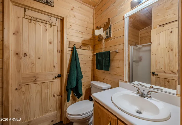 Guest Bathroom with access from laundry room and bedroom hallway.
