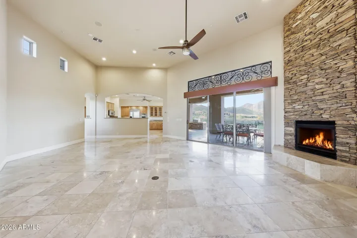 Natural stone tile flooring with a gorgeous stone fireplace