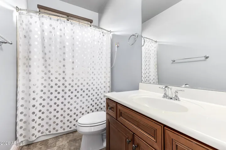 Clean and functional full bathroom in Goodyear with a tub and shower combination, modern vanity, and updated fixtures—ideal for guests or family use.