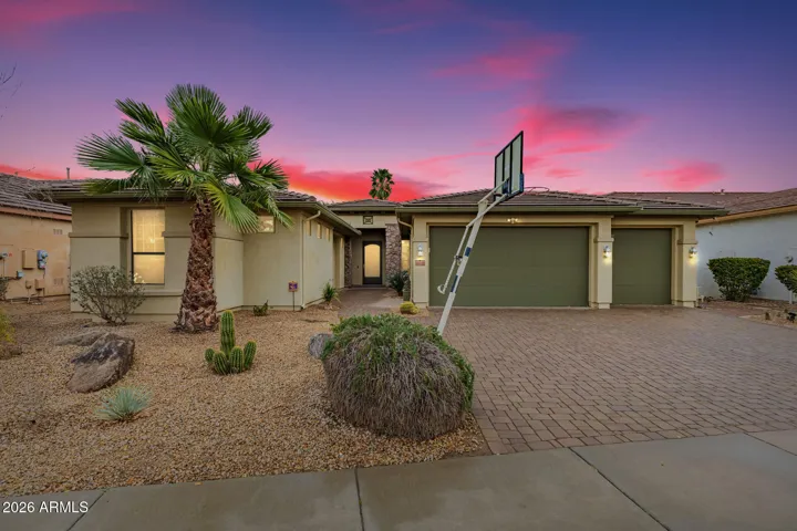 North/South facing Golden Heritage home with low maintenance front yard and built in basket ball hoop!