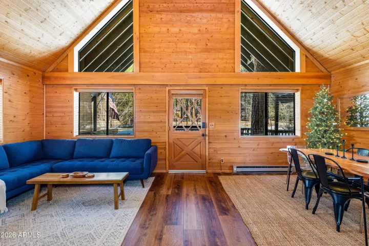 Peaked ceilings with ample natural light, NEW flooring, NEW interior paint, and NEW stove/fireplace.