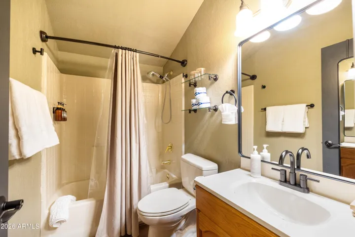 Primary Suite/Loft Bathroom with shower/tub with NEW paint.