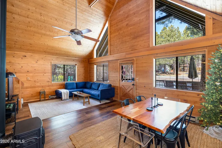 Peaked ceilings with ample natural light, NEW flooring, NEW interior paint, and NEW stove/fireplace.