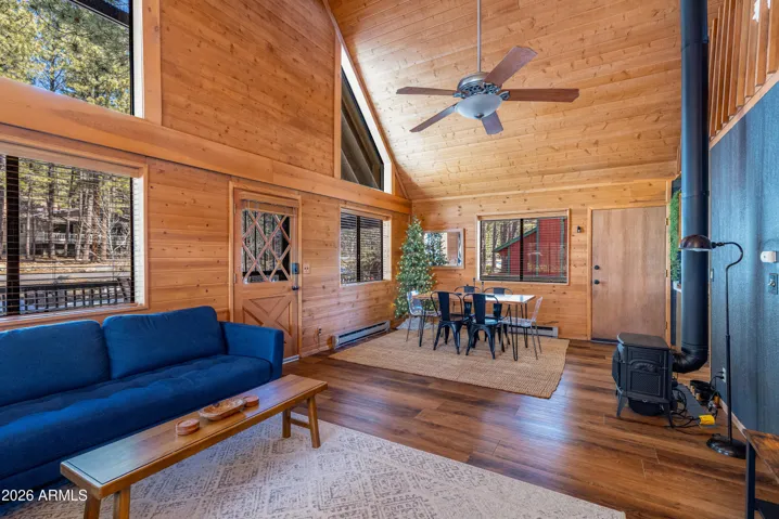 Peaked ceilings with ample natural light, NEW flooring, NEW interior paint, and NEW stove/fireplace.