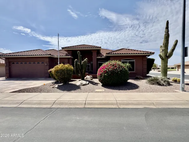 Beautifully landscaped corner lot on the golf course