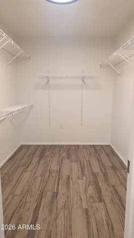 Large walk in closet for primary bedroom.