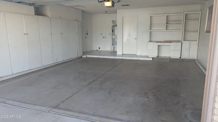 Garage has built in cabinets.