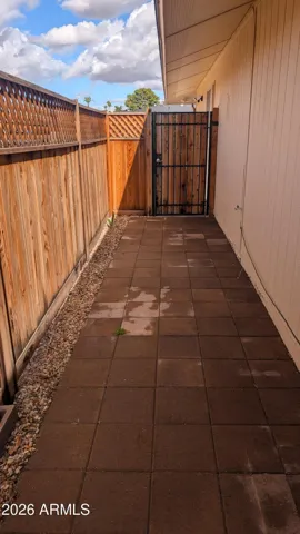 Completely fenced patio area to guest house.