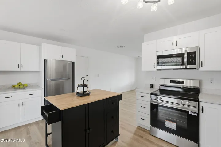 See photos 28-32 for other Kitchen set up ideas!