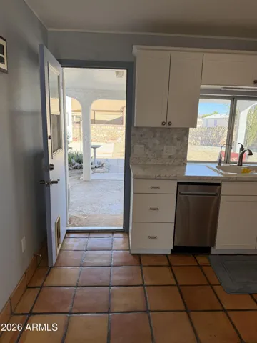 door to laundry and back patio