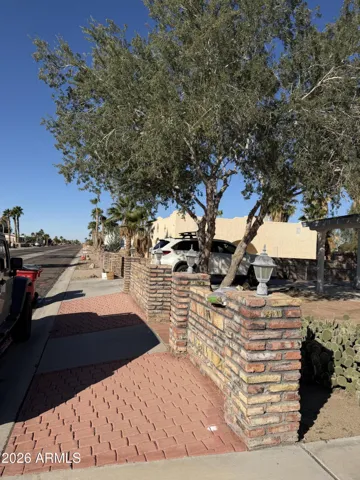 Front of home with partial wall
