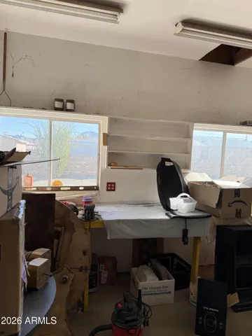 garage/ workshop with built in work bench and windows