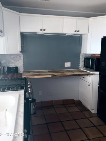 pull down butcher block counter...can be used for prep, eating and be put back up when finished using space