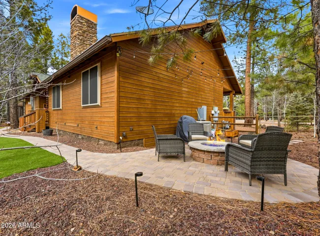 Paver patio in fenced yard
