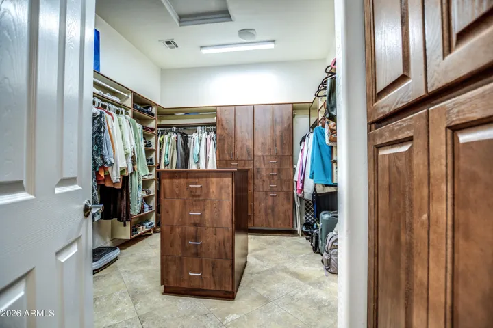 Custom closet in primary bedroom
