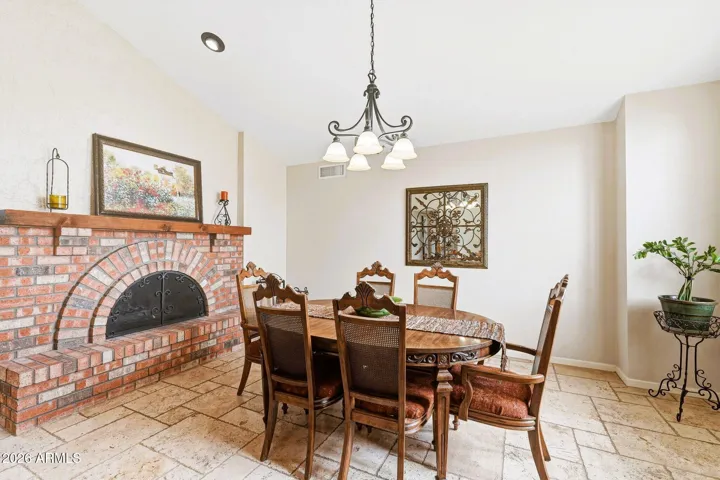 Two-way wood-burning fireplace in the formal dining area.