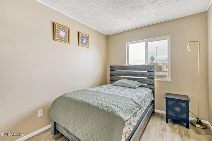Comfortable second bedroom with natural light and a simple, functional layout.