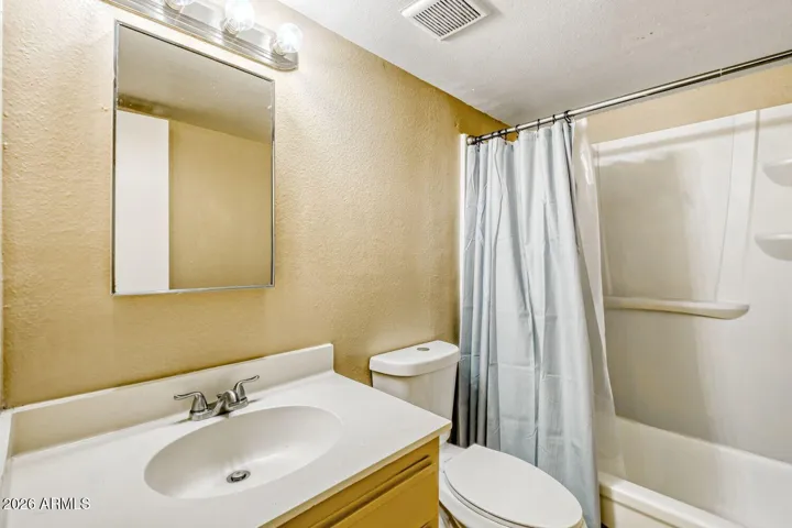Full bath with clean vanity and tub shower combo for daily use.