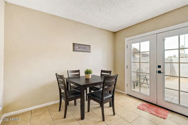 AI virtual staging shows this space set up as a dining area for layout and size reference.