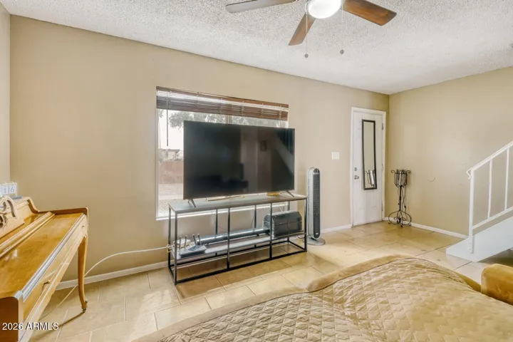 Foyer opens to the living room with stairs nearby for easy flow to the upper level.