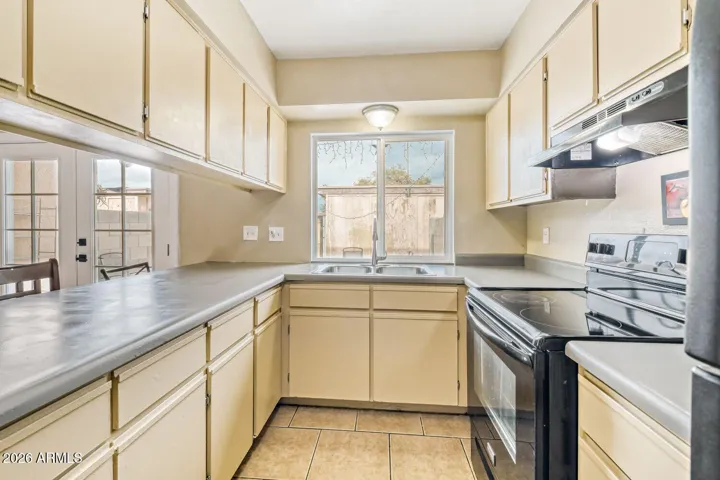 Functional kitchen with plenty of cabinet space for clean, simple living