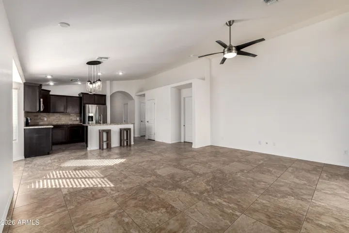 Looking towards dining area + kitchen.