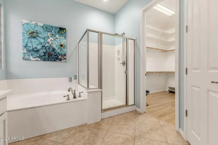 Separate soaking tub and shower.
