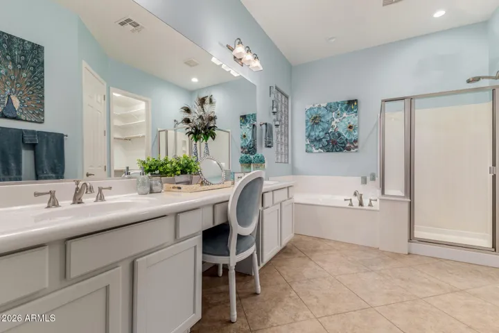 Primary bathroom with refreshed cabinets and custom paint.