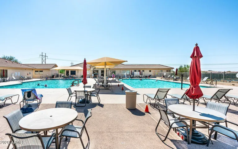 Resort-style heated pool area with spacious deck seating and stunning Superstition Mountain views.