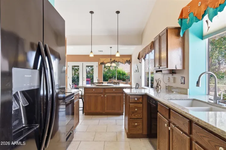 Functional kitchen layout with ample cabinet storage and generous counter space for everyday cooking