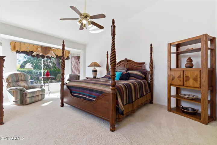 Generous primary suite with backyard views.