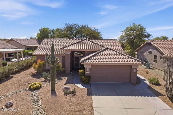 Spacious driveway leading to the 2-car garage with built-in storage
