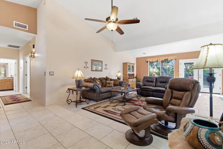 Open living area with tile flooring and neutral tones.
