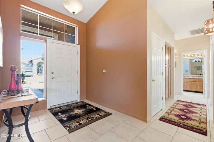 Front entry opens to spacious open floorplan with seamless flow to living and dining areas.