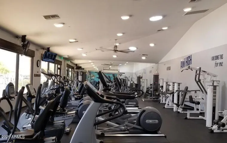 Well-equipped fitness center featuring a variety of cardio and strength-training equipment.