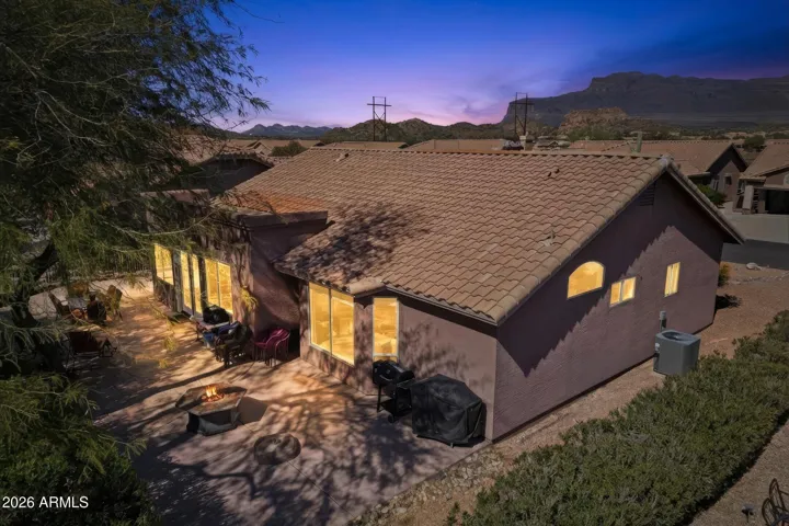 Evening aerial view showcasing the private backyard patio and peaceful setting.