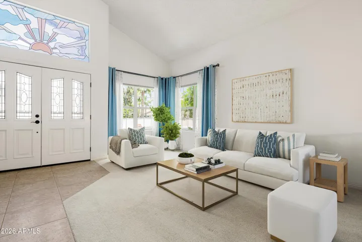 The living room is light and bright with vaulted ceilings.