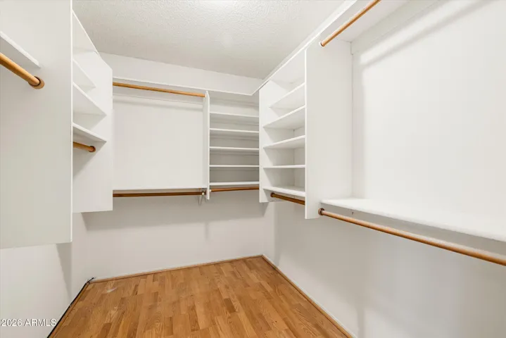 The primary suite boasts two walk-in closets.