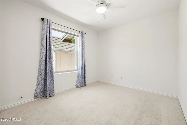 The downstairs bedroom is perfect for guests or as a home office. There is full bathroom across the hall.