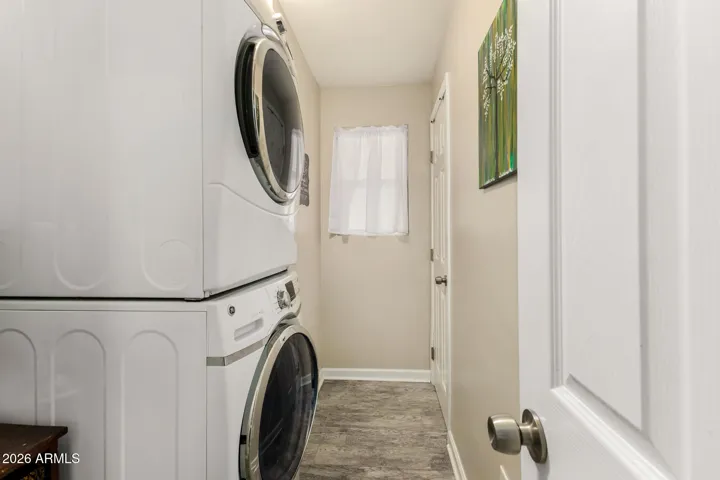 Laundry room with separate storage room