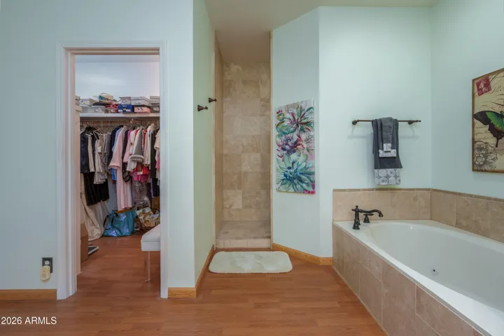Primary bathroom offers seperate tiled shower and deep soaker tub
