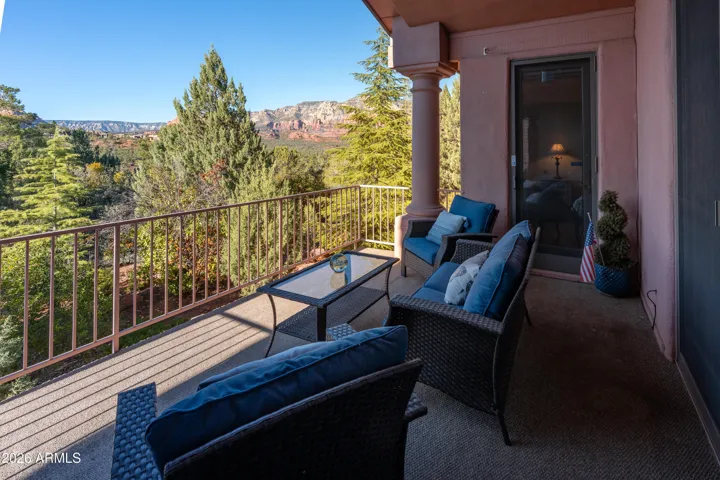 Patio faces red rock views and 89A & can be access from primary bedroom, den and living room areas
