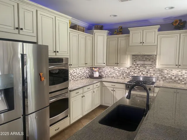 Kitchen counters, cabinets, and appliances, and Viking Gas Cooktop
